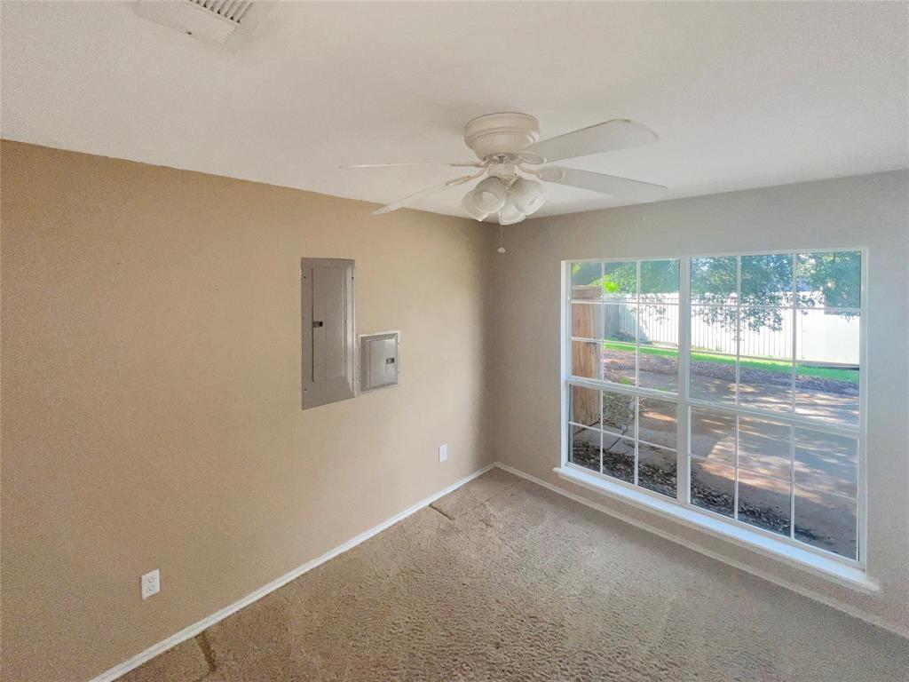 3661 Emo Street Midlothian, TX 76065 - Photo 23 of 24 a view of a livingroom with a ceiling fan and window