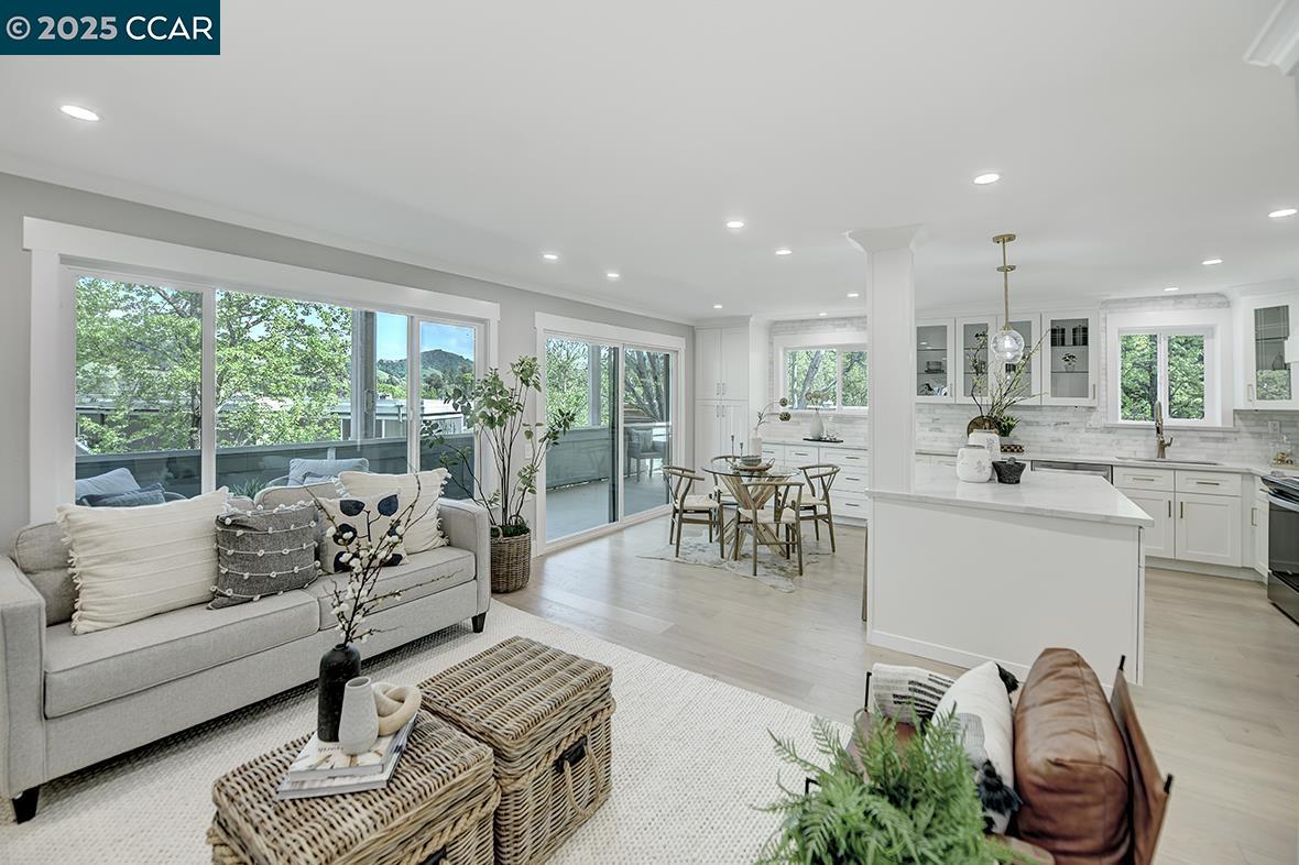1349 Running Springs Road, Unit 8 Walnut Creek, CA 94595 - Photo 1 of 1 a living room with furniture and a large window