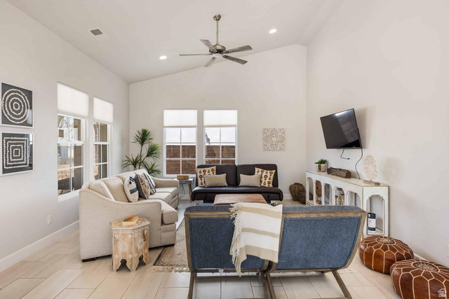4222 Hampshire Road Hurricane, UT 84737 - Photo 2 of 12 Living area featuring vaulted ceilings, recessed lighting, wood-finish flooring, a ceiling fan, and multiple windows