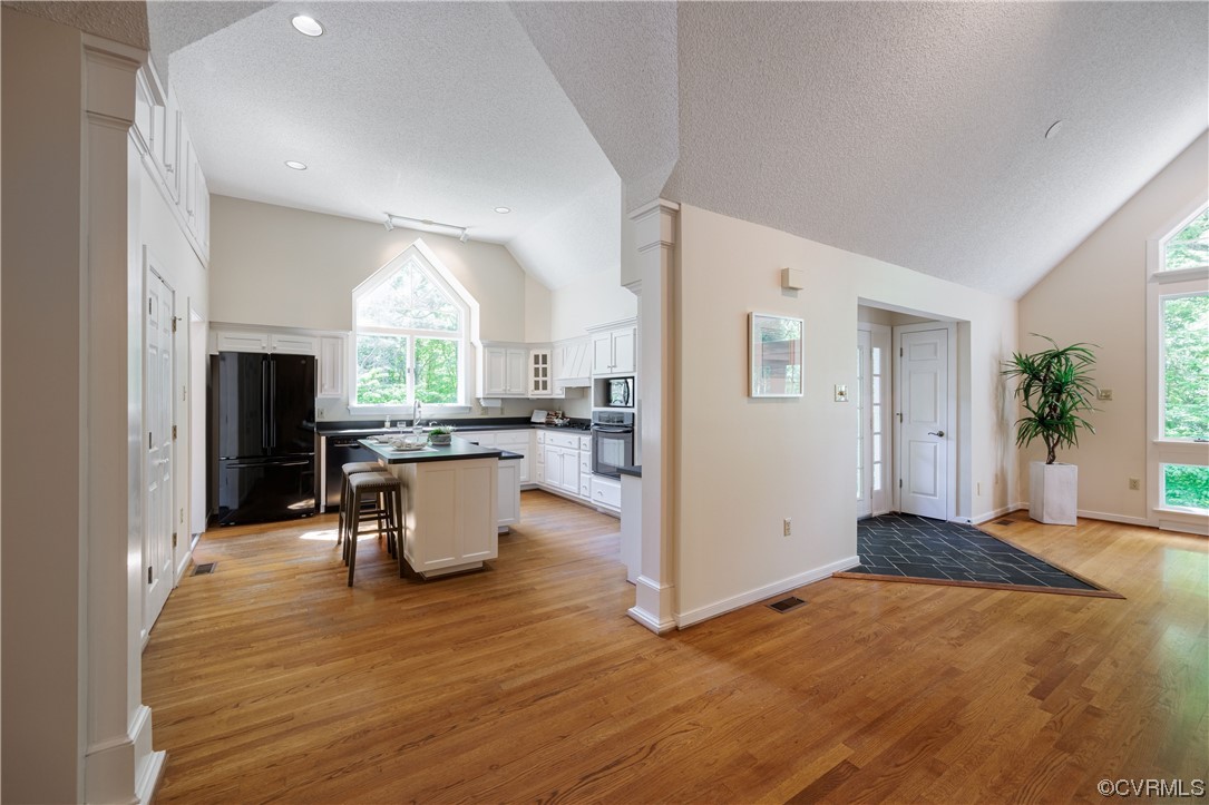 380 Ziontown Road Henrico, VA 23229 - Photo 13 of 44 a kitchen with kitchen island white cabinets and stainless steel appliances