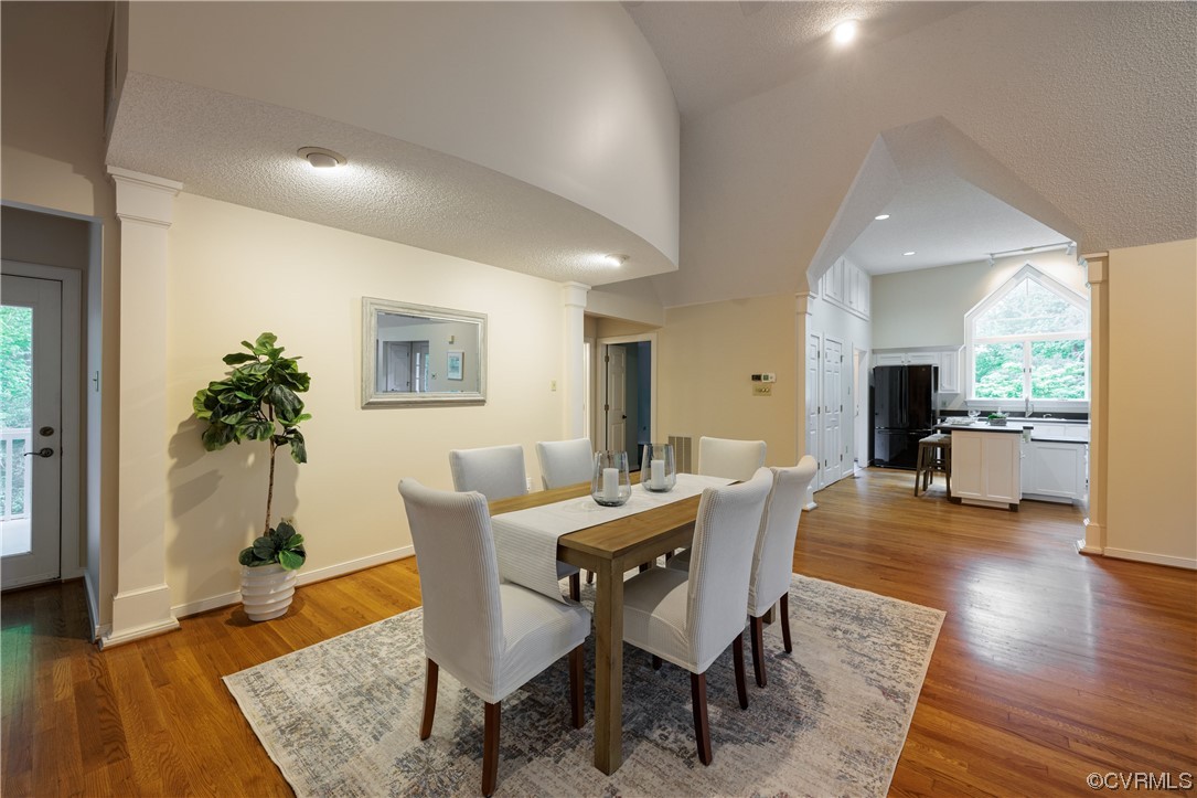 380 Ziontown Road Henrico, VA 23229 - Photo 14 of 44 a dining room with furniture window and wooden floor
