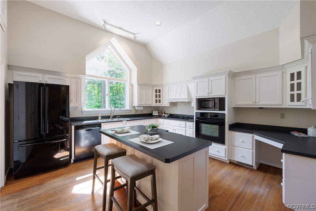 380 Ziontown Road Henrico, VA 23229 - Photo 21 of 44 a kitchen with a stove a sink dishwasher a refrigerator with wooden floor and cabinets