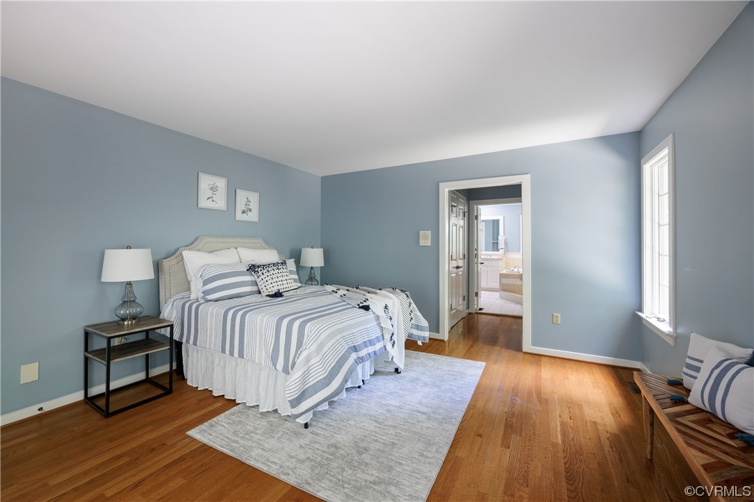 380 Ziontown Road Henrico, VA 23229 - Photo 23 of 44 a bedroom with a bed and wooden floor