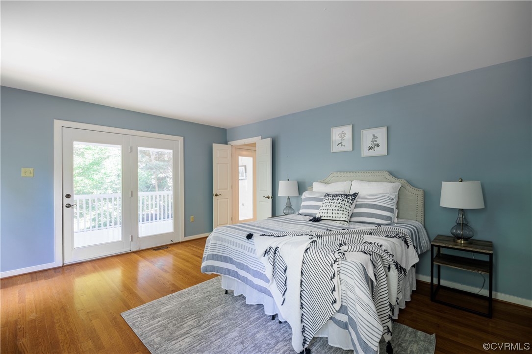 380 Ziontown Road Henrico, VA 23229 - Photo 24 of 44 a bedroom with a bed and wooden floor