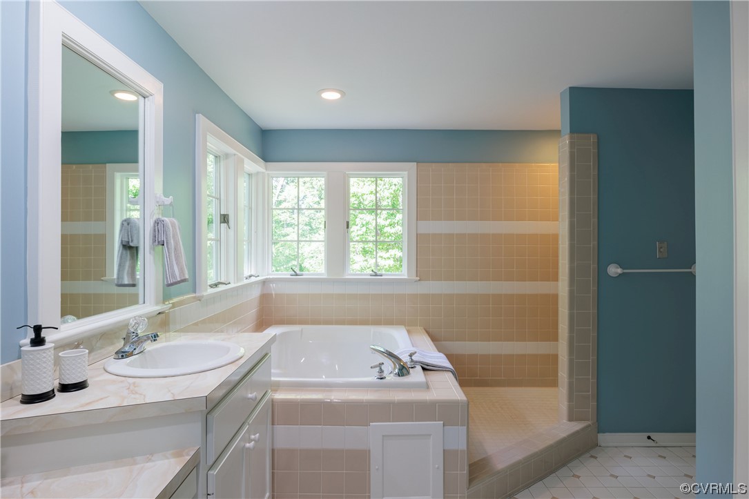 380 Ziontown Road Henrico, VA 23229 - Photo 29 of 44 a bathroom with a granite countertop sink a mirror and a bathtub