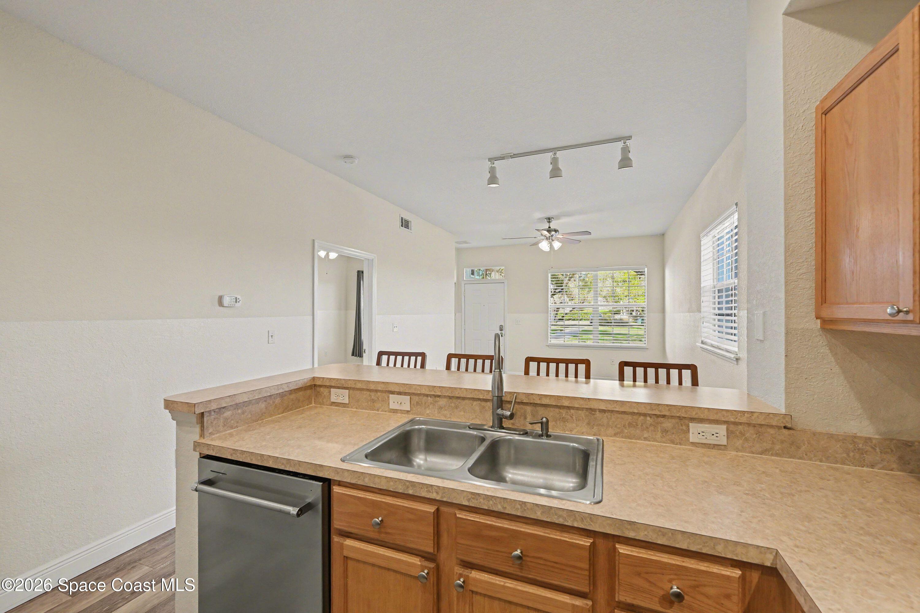 100 Turpial Way, Unit 108 Melbourne, FL 32901 - Photo 9 of 26 Kitchen looking into living area