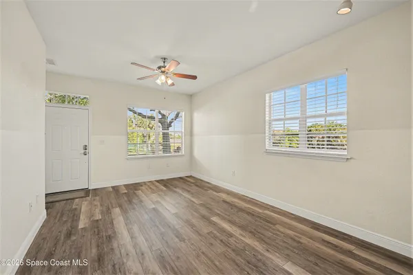 a view of an empty room with a window