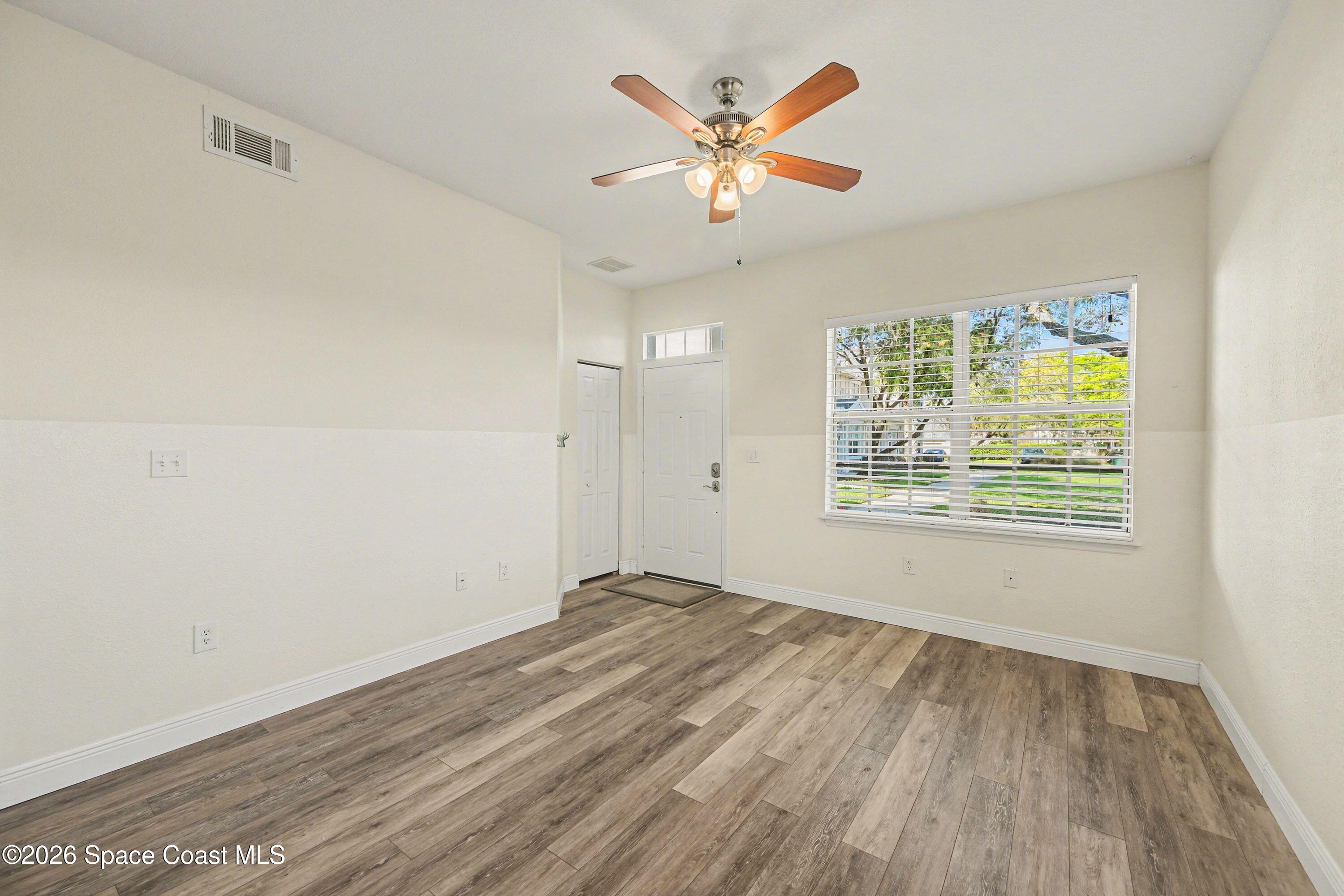 100 Turpial Way, Unit 108 Melbourne, FL 32901 - Photo 6 of 26 Living & entry photo 2