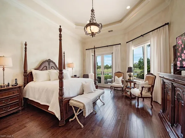 a bathroom with a granite countertop sink mirror and tub