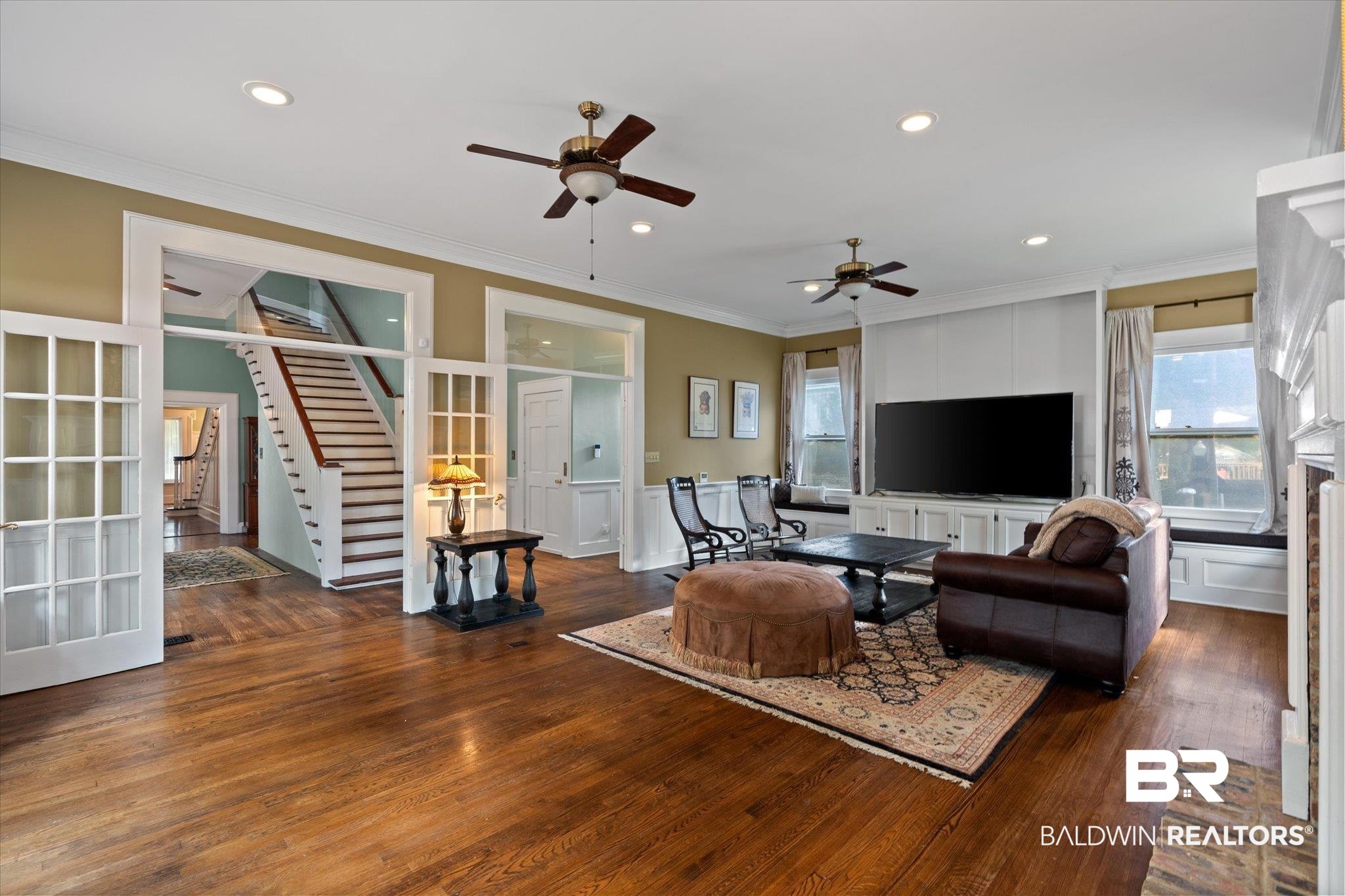 1953 Dauphin Street Mobile, AL 36606 - Photo 14 of 56 Living room featuring ceiling fan, dark hardwood / wood-style flooring, and ornamental molding