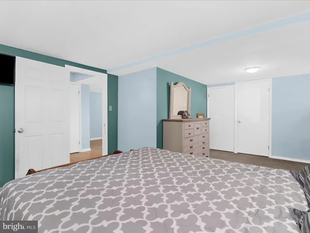 a bathroom with a sink toilet and mirror