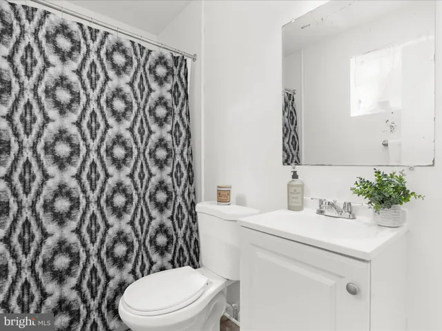 a kitchen with granite countertop a sink stove and cabinets