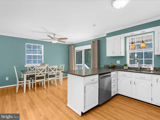 a kitchen with a refrigerator a microwave a sink and a stove