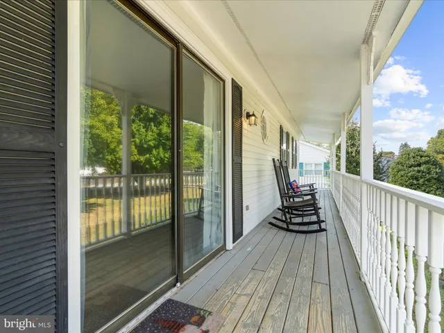 a bathroom with a sink toilet and window