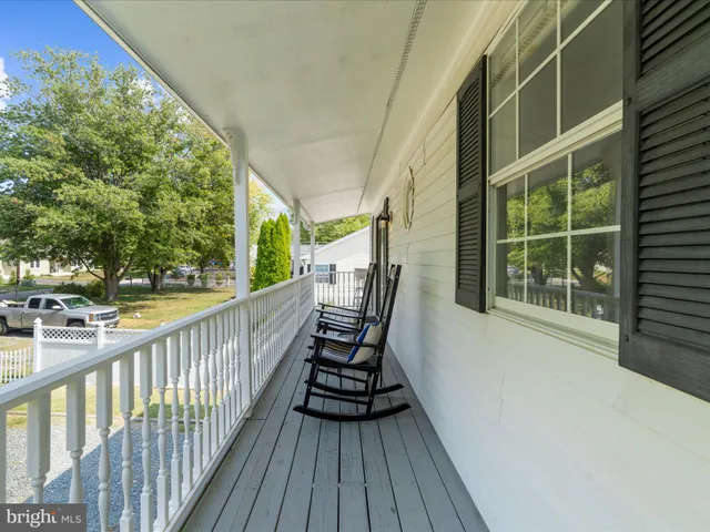 a utility room with a shower curtain and a sink