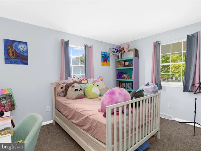 a view of a patio with a dining table and chairs with wooden floor