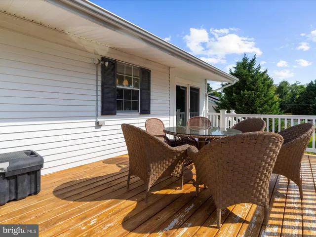 a swimming pool with trees in the background