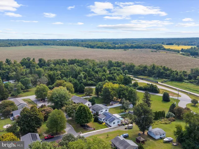 a view of a house with a yard and garage