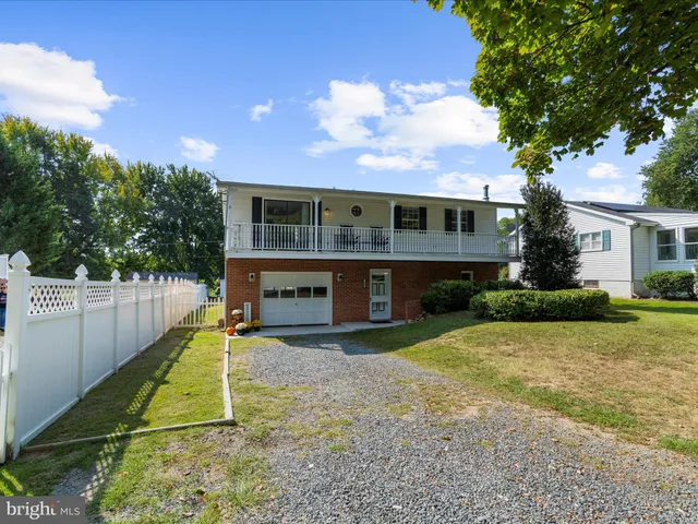 a view of a lake with a yard