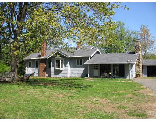 121 Palmer Road Monson, MA 01057 - Photo 1 of 10 a house view with a sitting space and garden