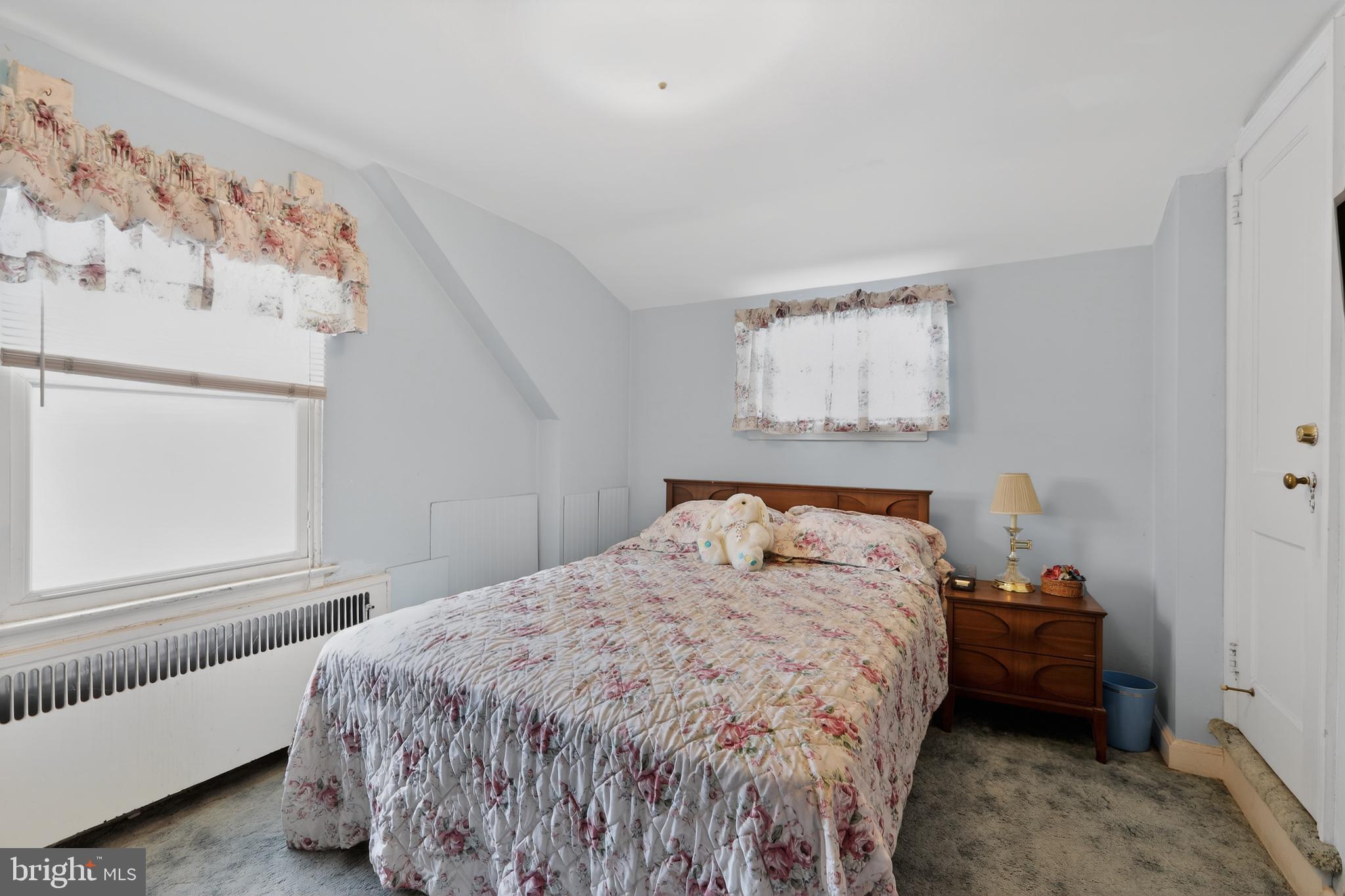 1424 Burmont Road Havertown, PA 19083 - Photo 31 of 37 a bedroom with a bed and a window