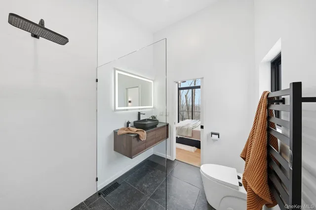 a bedroom with furniture and a window