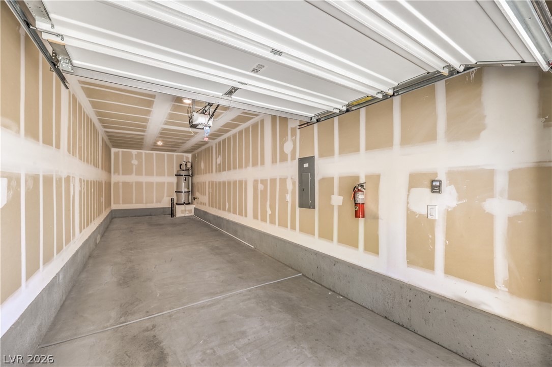 12103 Mojave Gold Road, Unit 4 Las Vegas, NV 89183 - Photo 18 of 23 A spacious and deep garage offers poured concrete flooring and drywall construction.