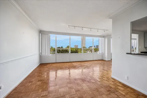 a view of an empty room with a window