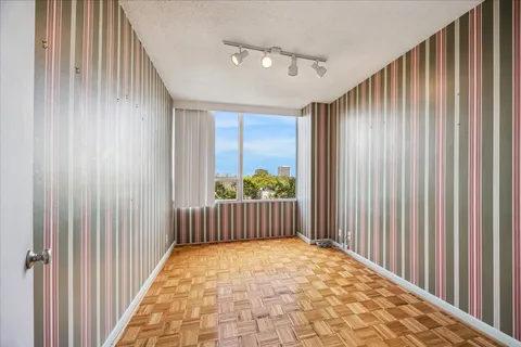 a view of hallway with balcony