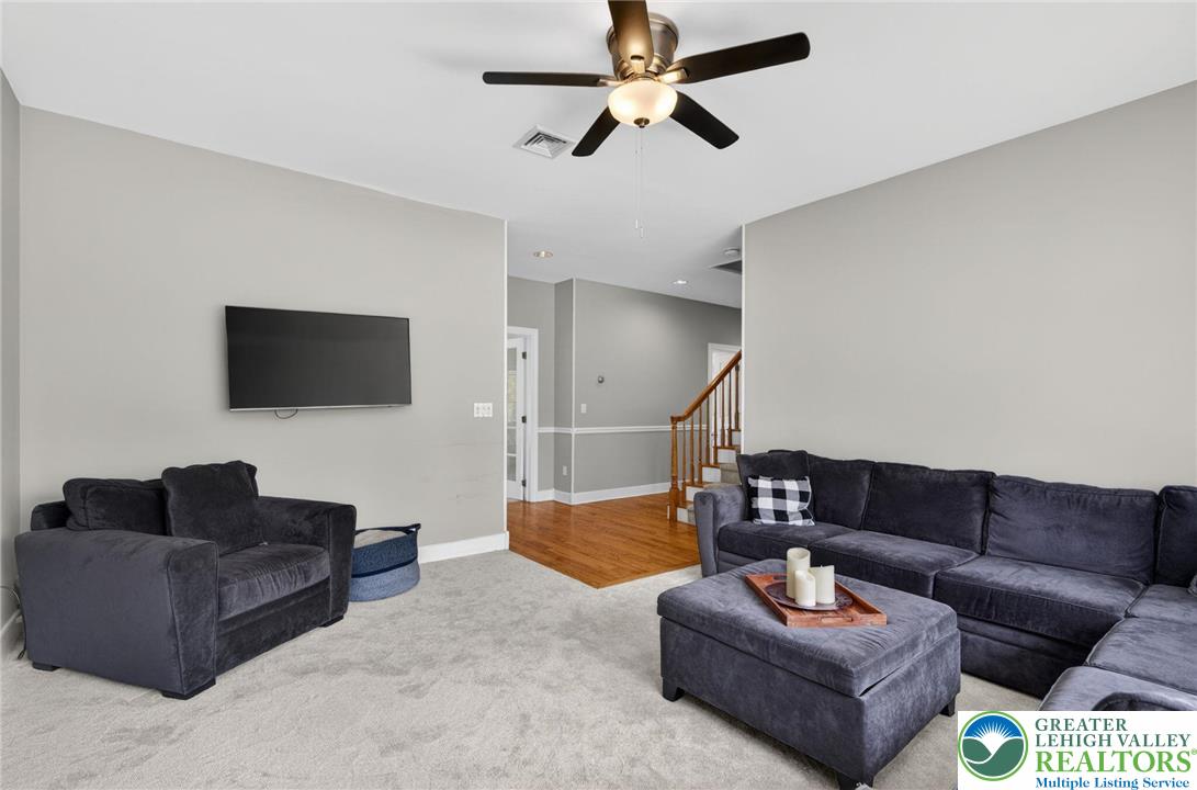 5255 Landis Mill Road Bethlehem, PA 18015 - Photo 18 of 50 a living room with furniture and a flat screen tv