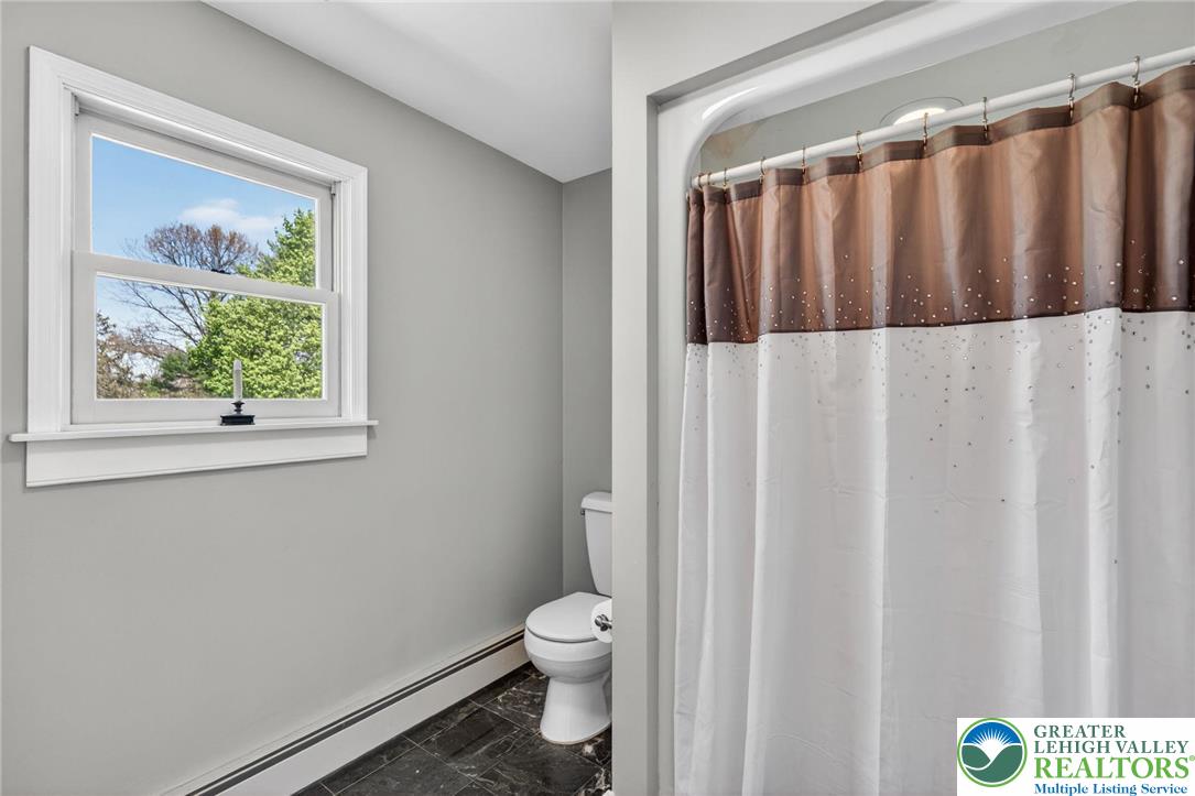 5255 Landis Mill Road Bethlehem, PA 18015 - Photo 31 of 50 a bathroom with a toilet and a window