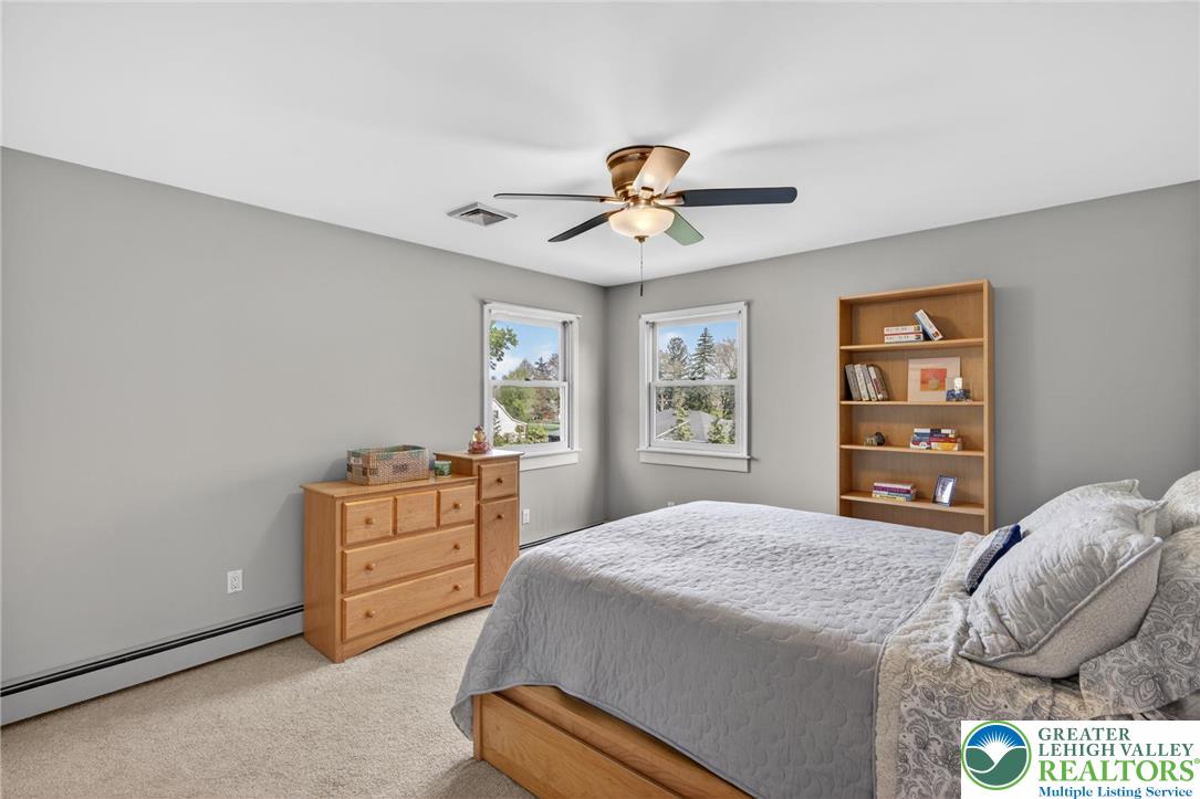 5255 Landis Mill Road Bethlehem, PA 18015 - Photo 36 of 50 a bedroom with a bed and a chandelier
