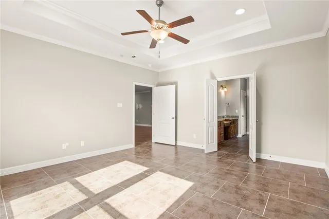 a spacious bathroom with a granite countertop sink and a mirror