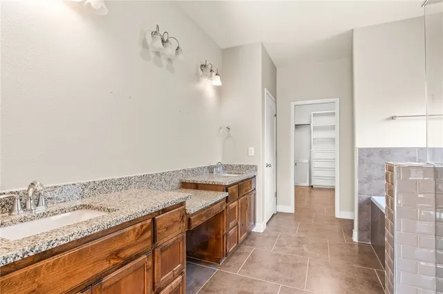 a bathroom with a bathtub and a sink