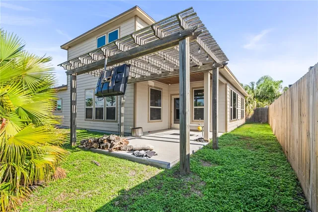 a view of a patio with table and chairs and potted plants