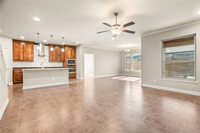 a view of a kitchen with a sink and cabinets