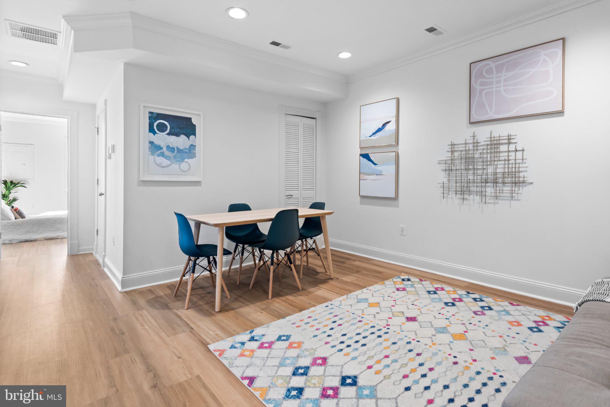 1238 Queen Street Northeast, Unit 3 Washington, DC 20002 - Photo 3 of 15 Modern dining space with artistic flair.