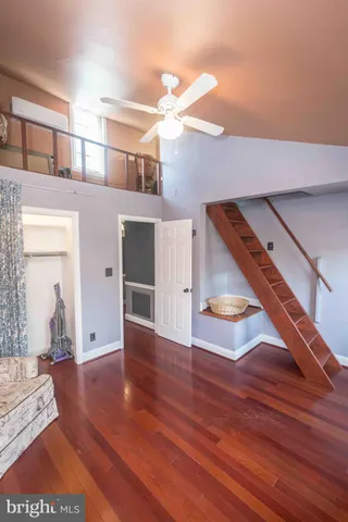 a view of an entryway with wooden floor