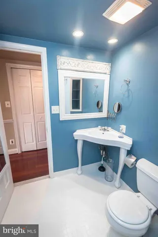 a view of a backyard with table and chairs and potted plants