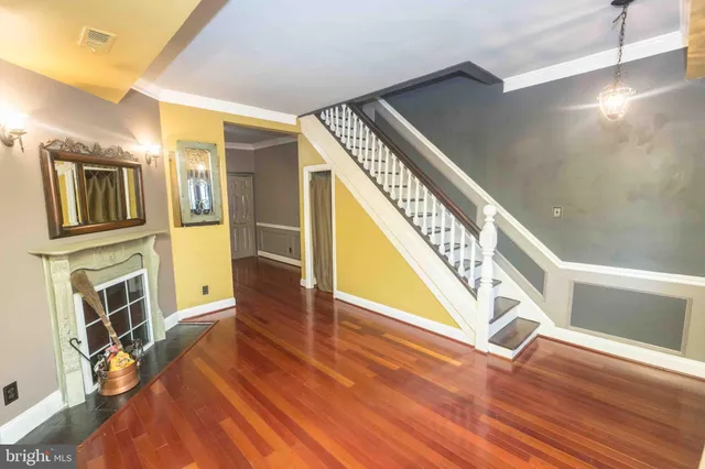 a view of an entryway with wooden floor