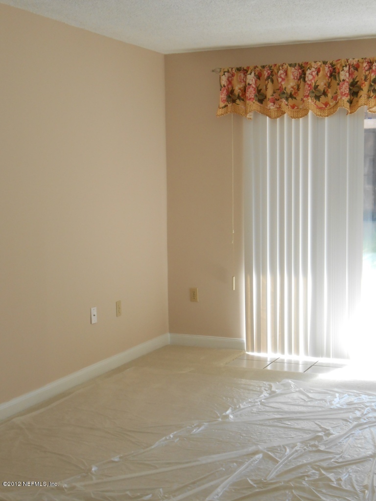 7175 A1A South, Unit E130 St. Augustine, FL 32080 - Photo 11 of 21 an empty room with a window