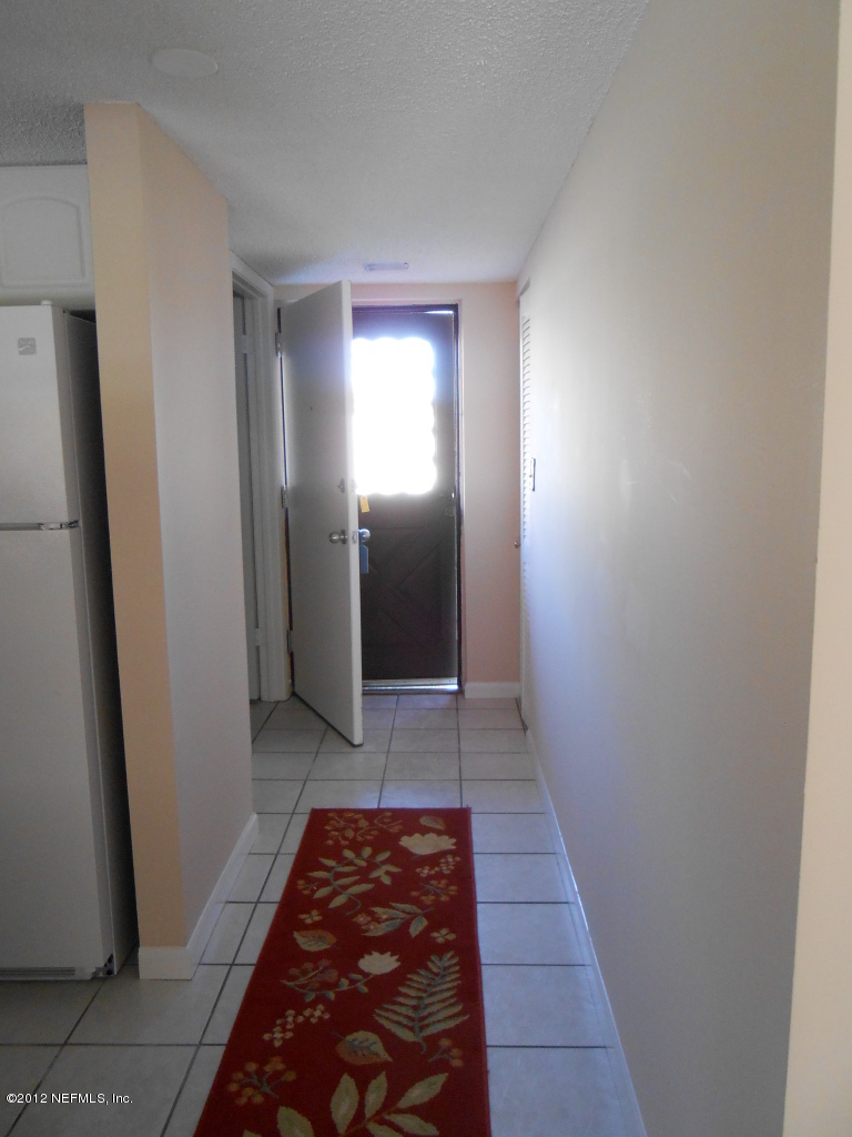 7175 A1A South, Unit E130 St. Augustine, FL 32080 - Photo 20 of 21 a walk in closet with white walls