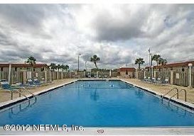 7175 A1A South, Unit E130 St. Augustine, FL 32080 - Photo 2 of 21 a view of a swimming pool with an outdoor seating