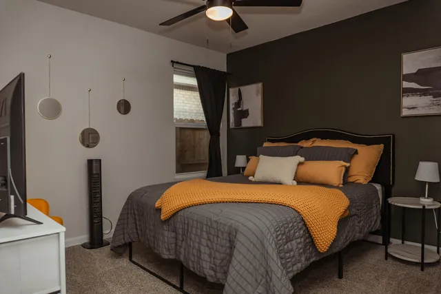 a bedroom with a bed and cupboard