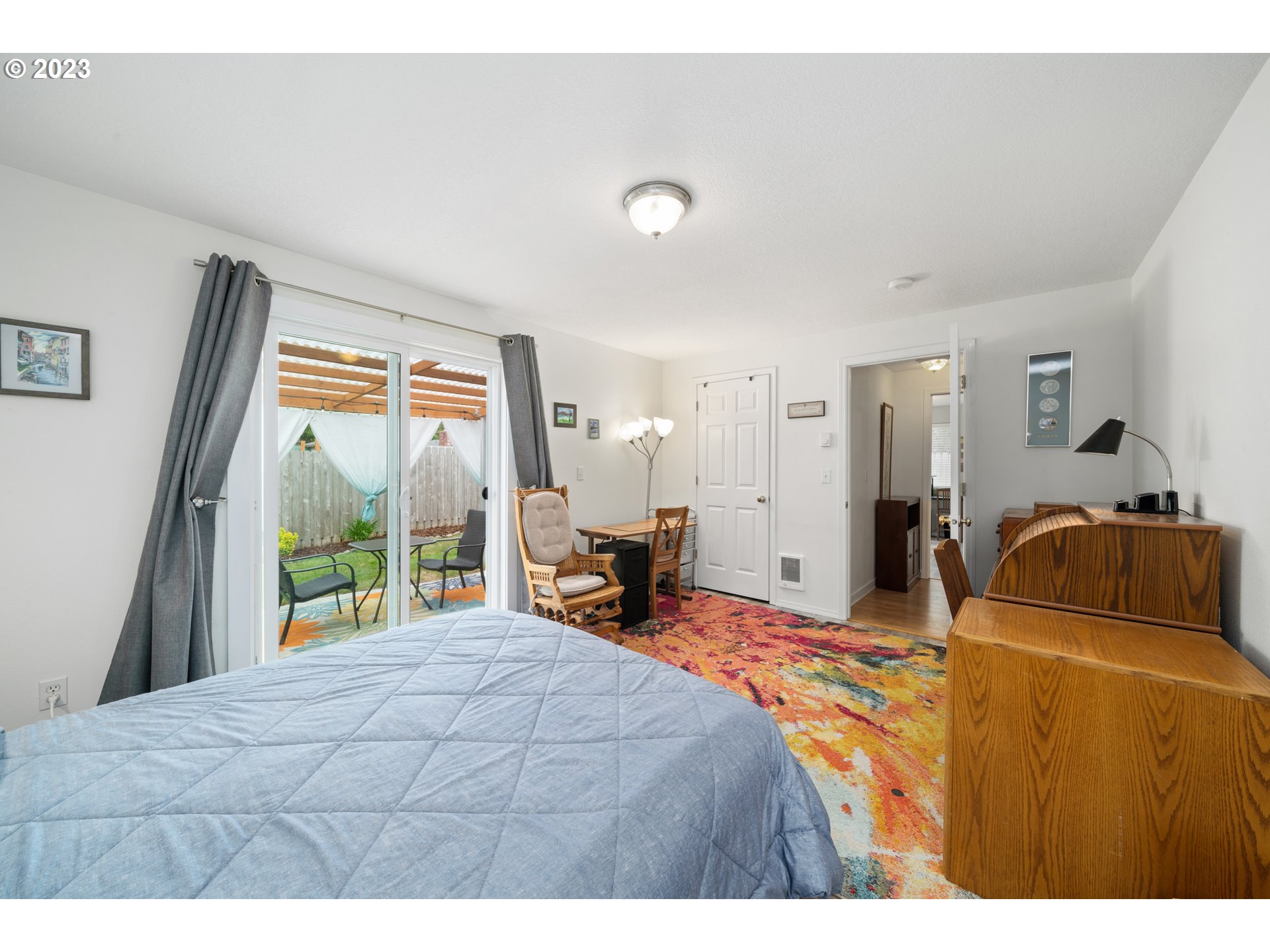 34100 Pintail Avenue Nehalem, OR 97131 - Photo 18 of 31 a bedroom with a bed and large windows