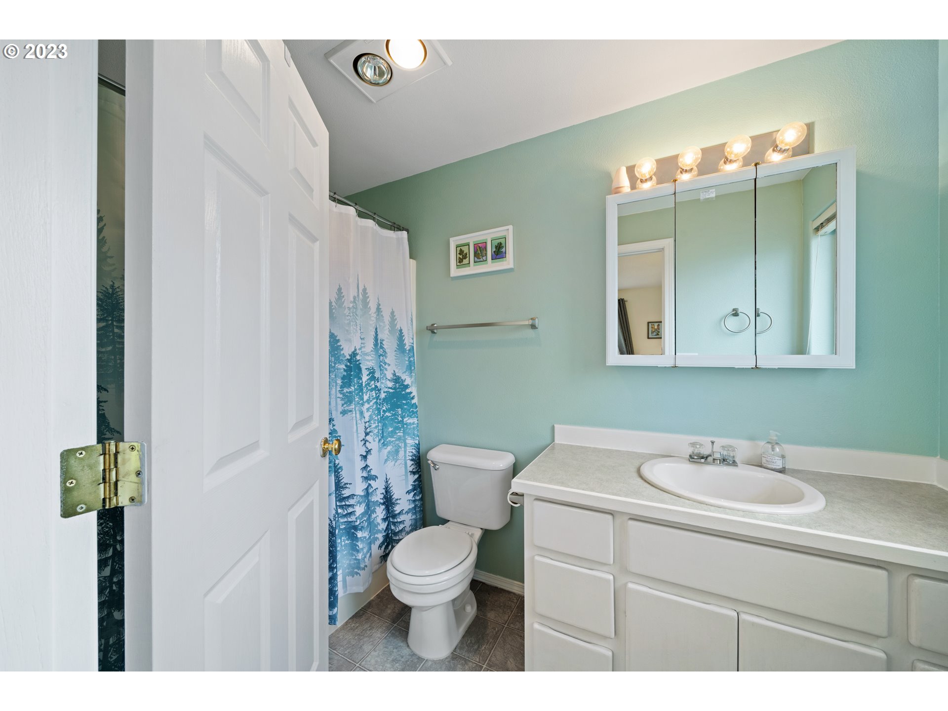 34100 Pintail Avenue Nehalem, OR 97131 - Photo 19 of 31 a bathroom with a sink vanity mirror and toilet