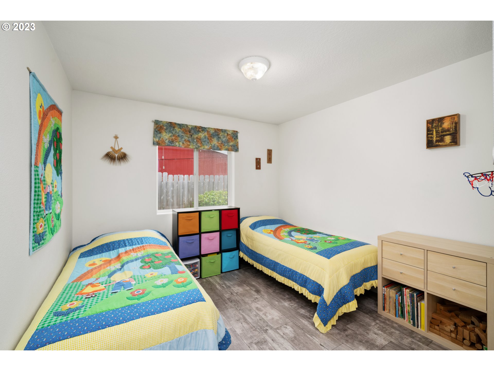 34100 Pintail Avenue Nehalem, OR 97131 - Photo 20 of 31 a bedroom with a bed and a painting on the wall