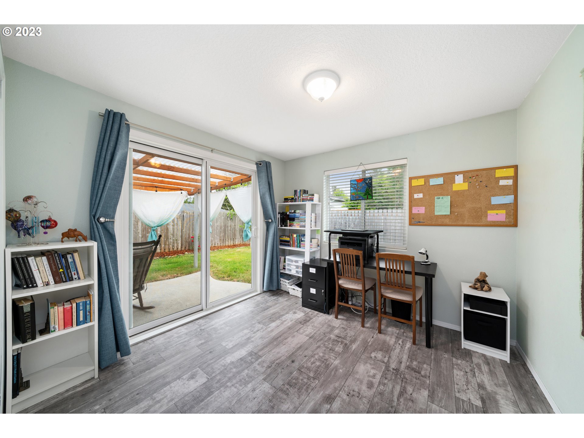34100 Pintail Avenue Nehalem, OR 97131 - Photo 22 of 31 a living room with furniture a bookshelf and a window