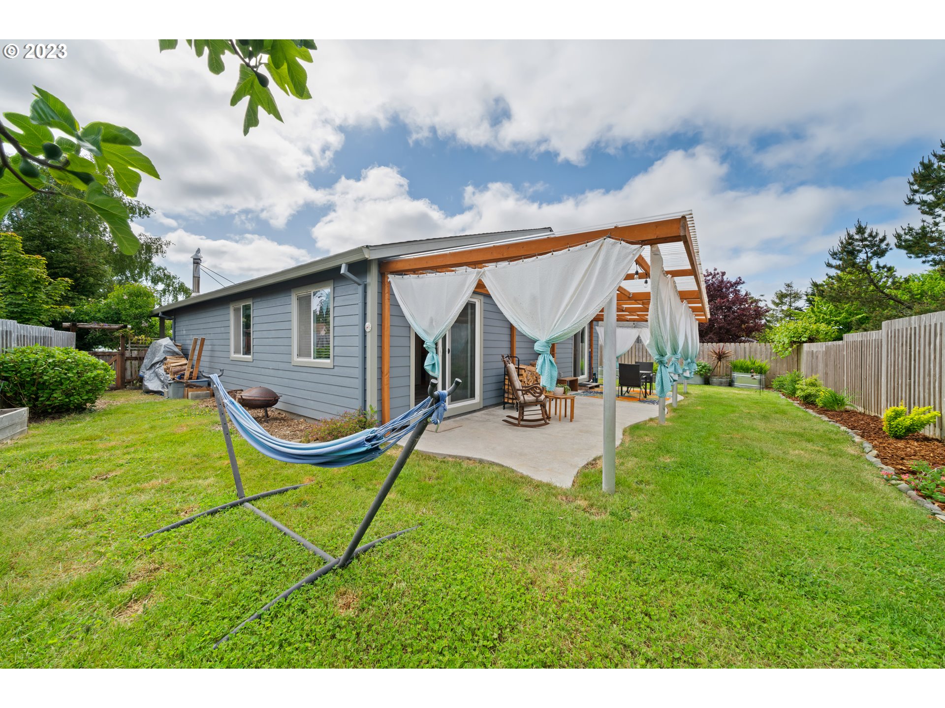 34100 Pintail Avenue Nehalem, OR 97131 - Photo 25 of 31 a view of a house with backyard porch and sitting area