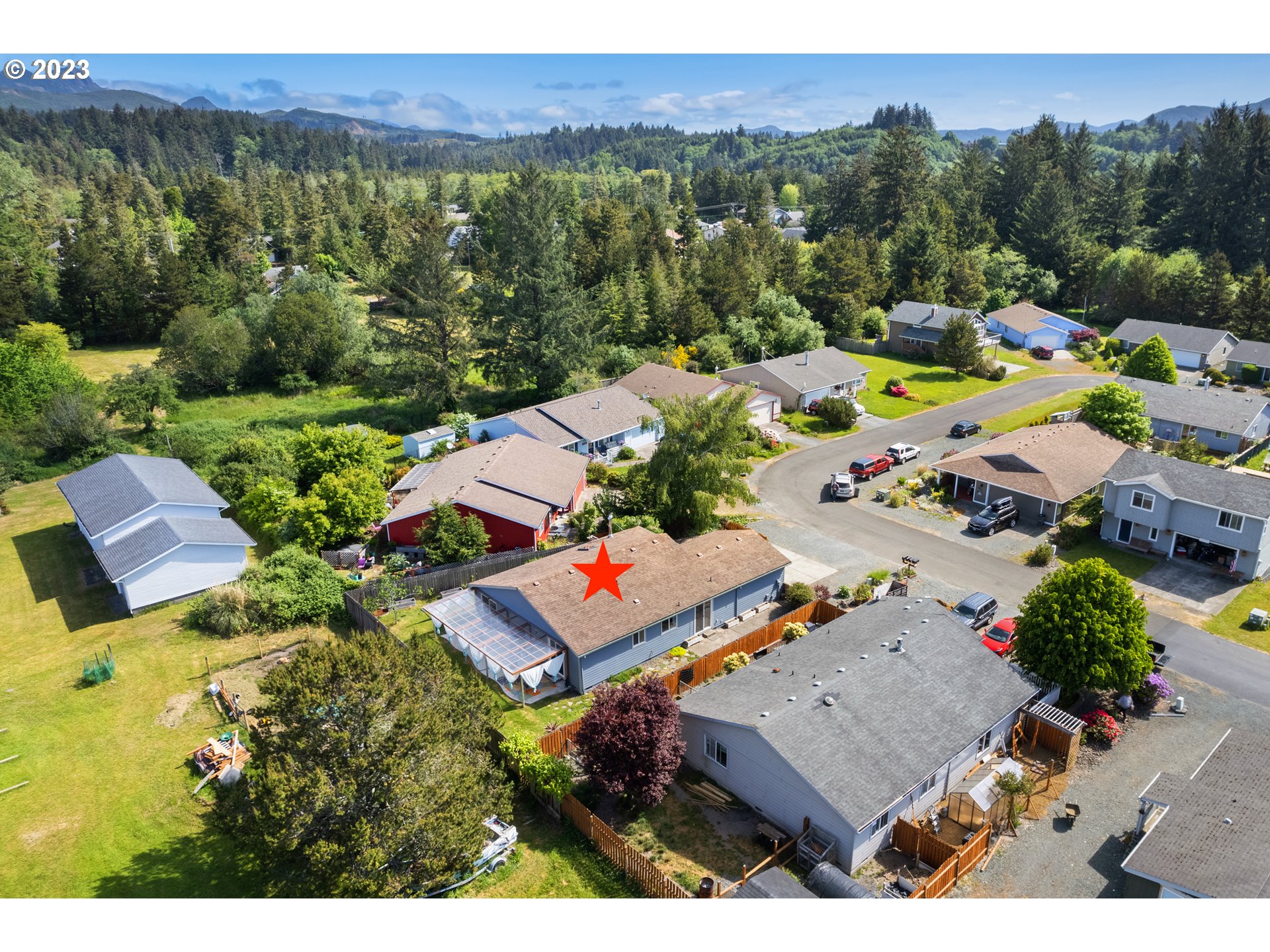 34100 Pintail Avenue Nehalem, OR 97131 - Photo 30 of 31 a view of a house with pool and a yard